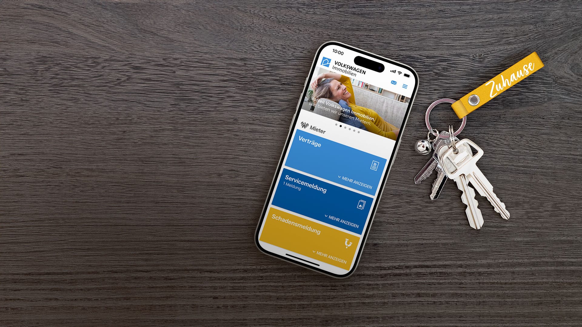 Smartphone mit Mein VWI App und Schlüssel auf Tisch